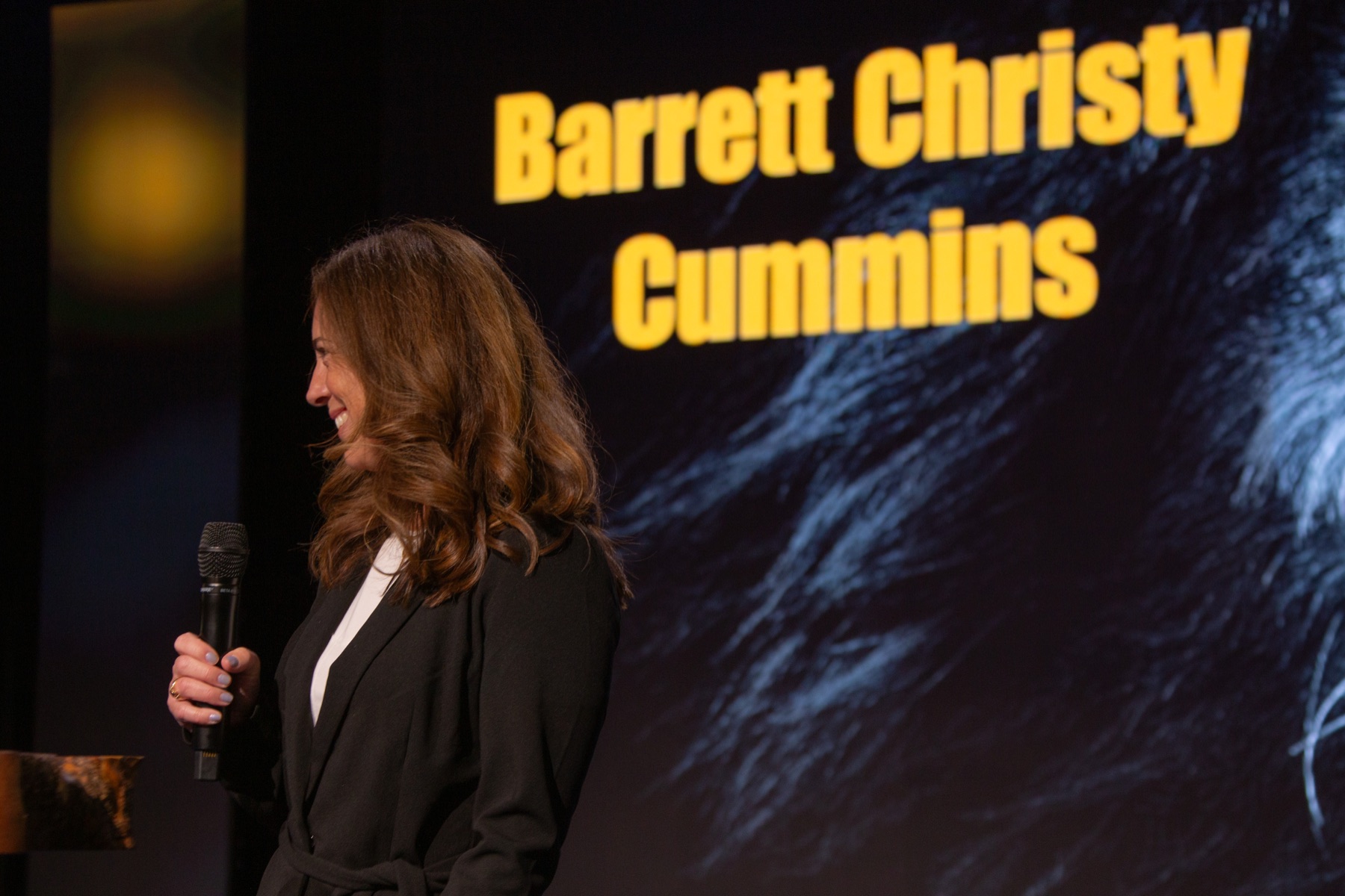 Barrett Christy Cummins speaking on stage
